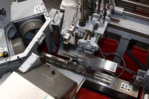 Hollow grinding of knife blades with automatic loading and unloading