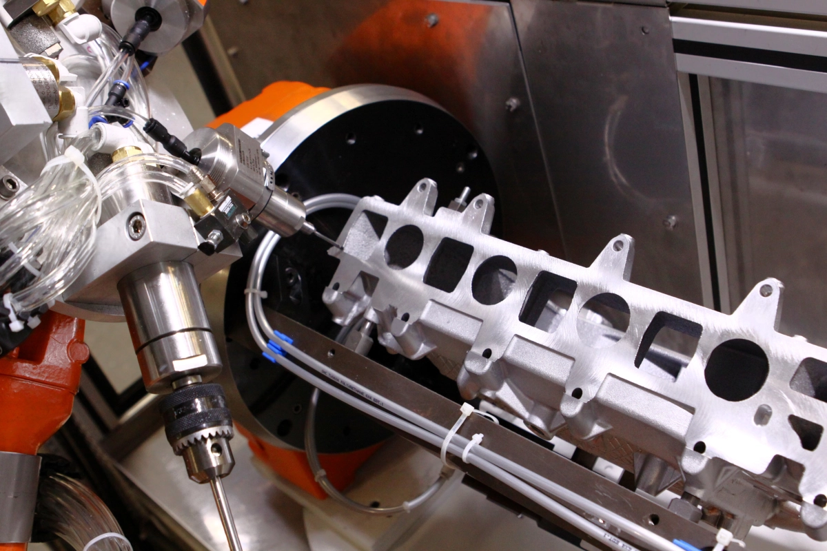 Robotic system for deburring and milling die-cast parts