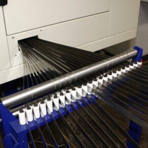 Simultaneous serrated egde grinding